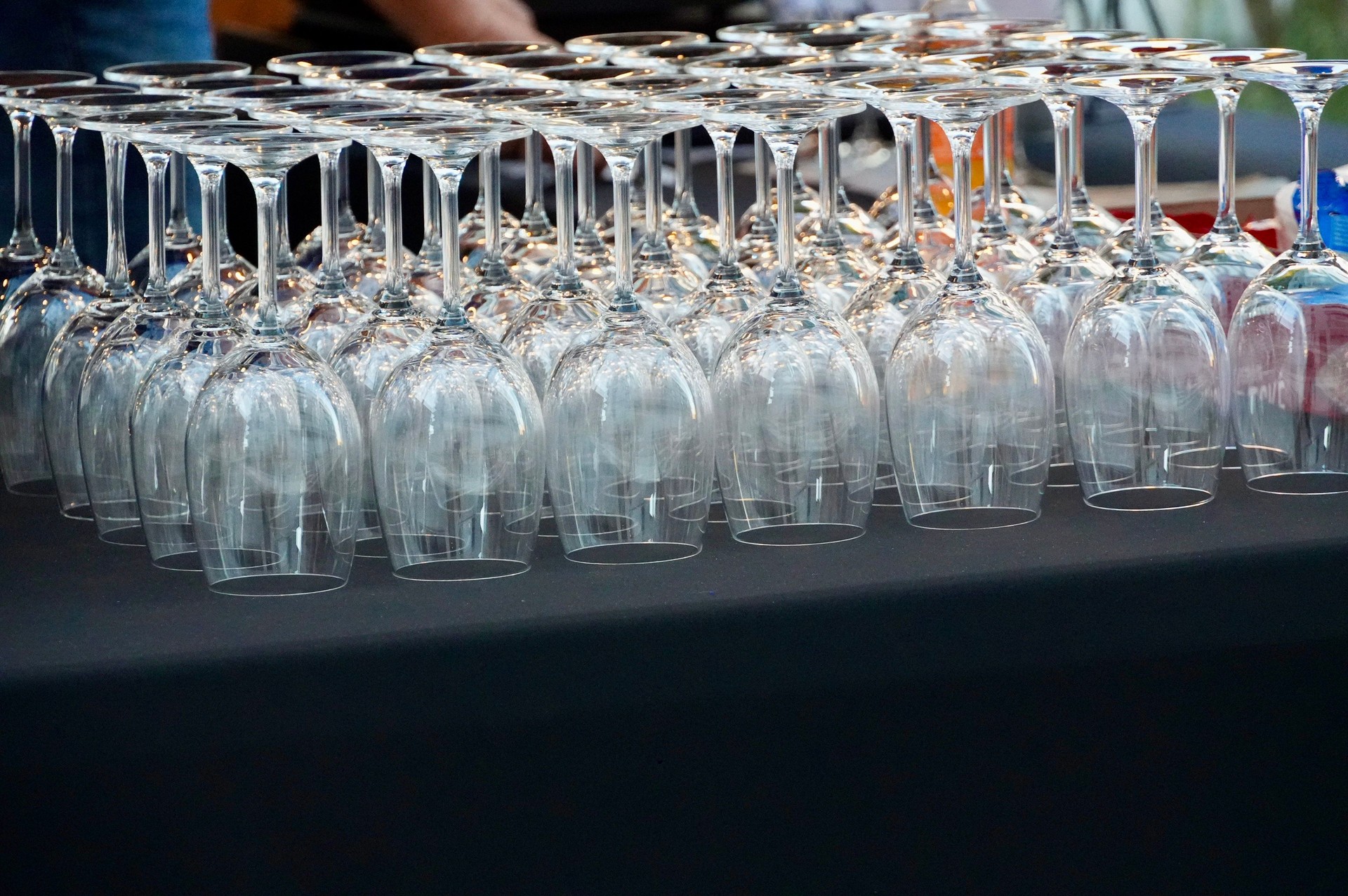 Wine glasses in row on the table, ready to be served
